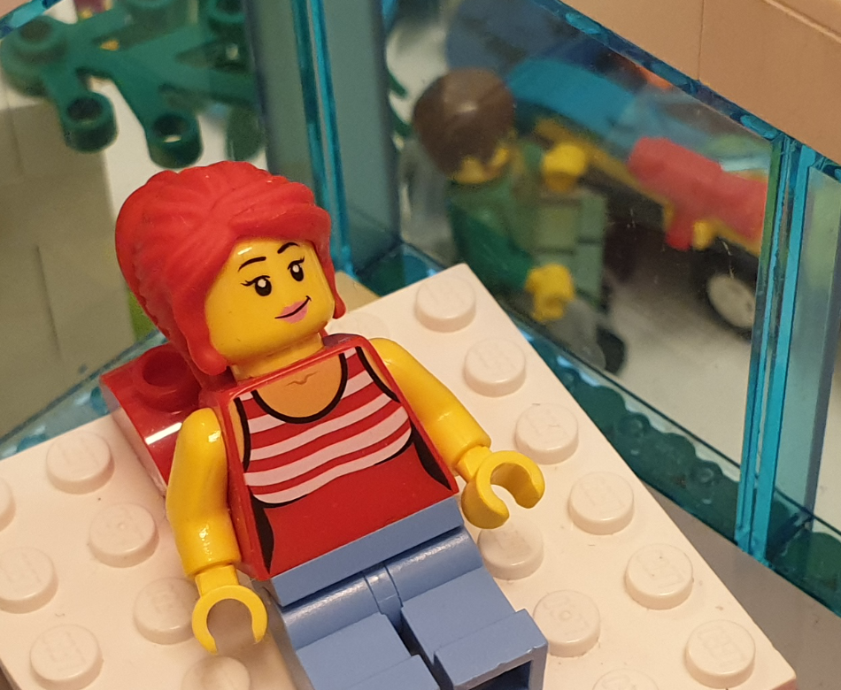 YAC auf Bett im Hintergrund ein Rollstuhlfahrer